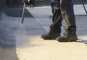 Coating systems over Tulsa spray foam roof systems